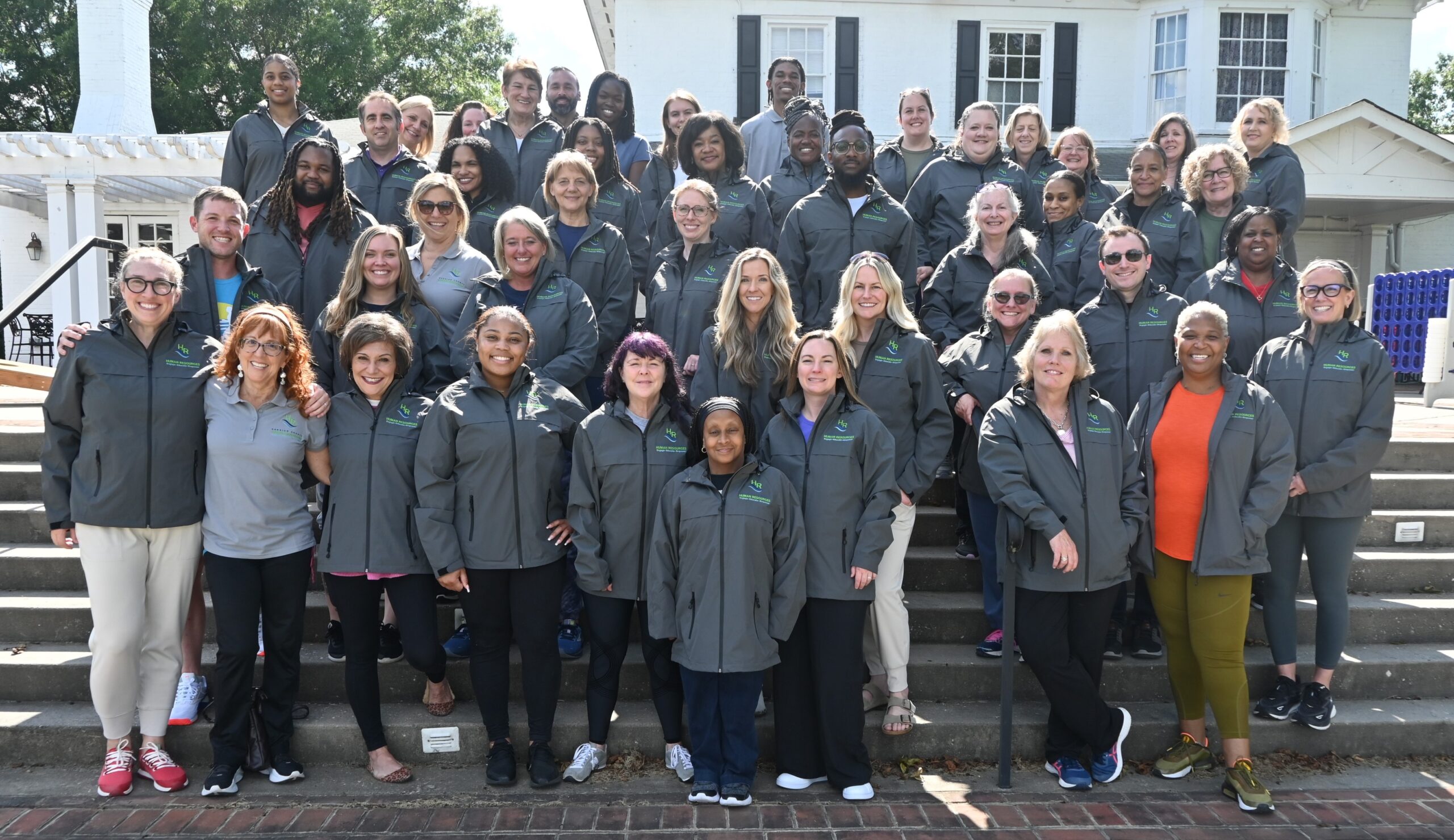 Henrico HR Employees group photo of everyone standing on some stairs and smiling at the camera