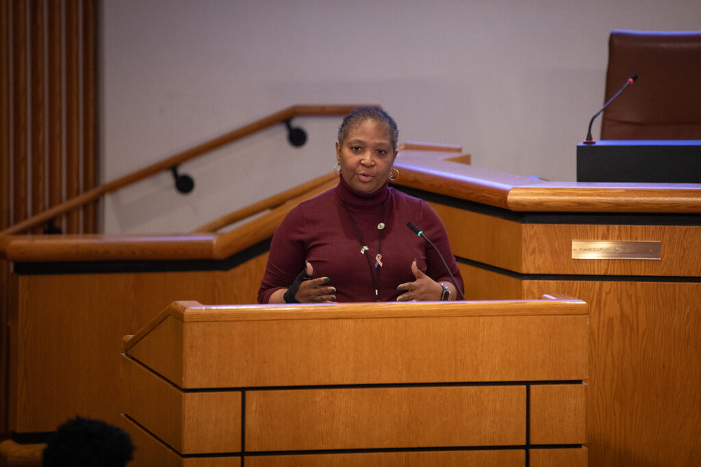 Up close of Yvette George speaking at the podium